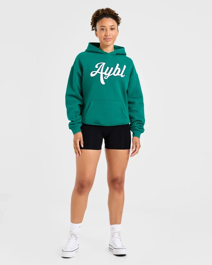 Oversized hoodie met geborduurd opschrift