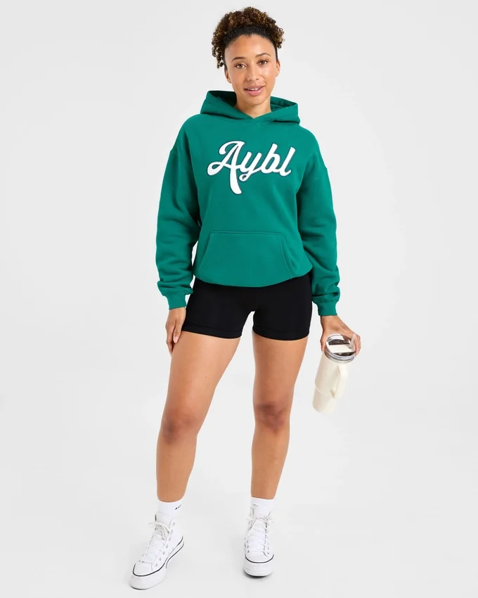 Oversized hoodie met geborduurd opschrift